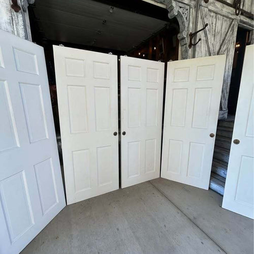 Three sets of 60”  Solid Wood Six Panel Bypass Doors
