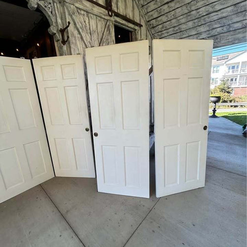 Three sets of 60”  Solid Wood Six Panel Bypass Doors