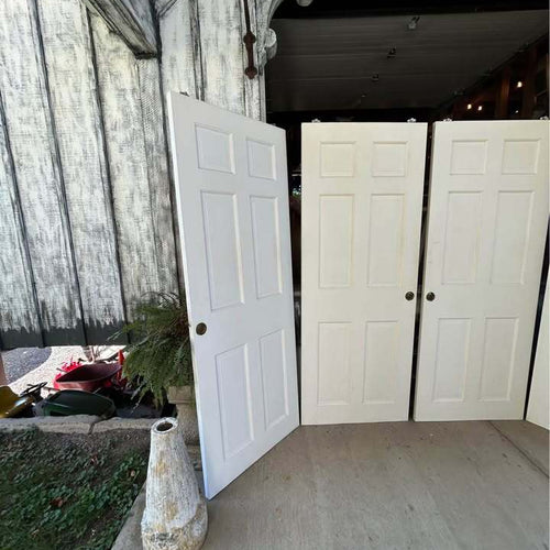 Three sets of 60”  Solid Wood Six Panel Bypass Doors